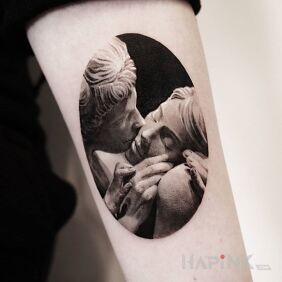 Tattoo A kiss on the cheek on the forearm motif: black and gray style: graphic / illustrative
