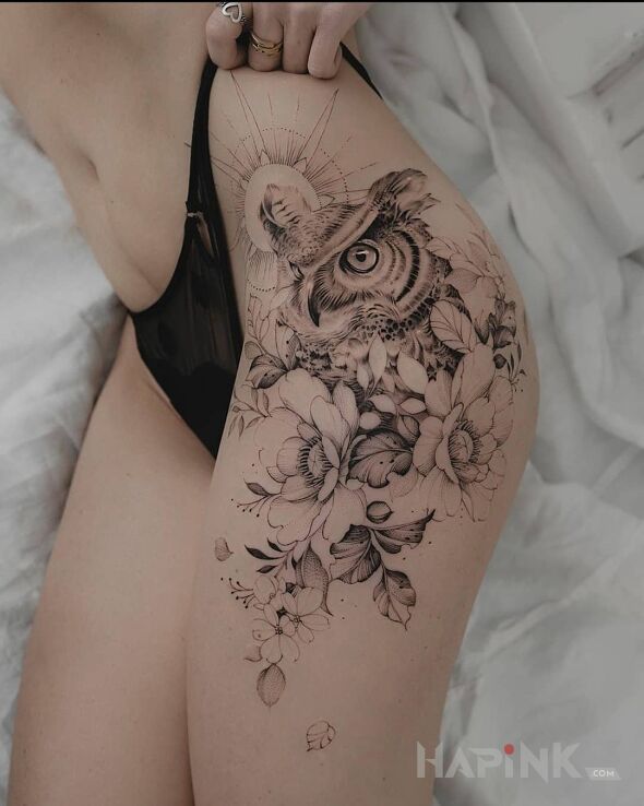 Tattoo Sowa in black and gray motif and realistic style on the leg