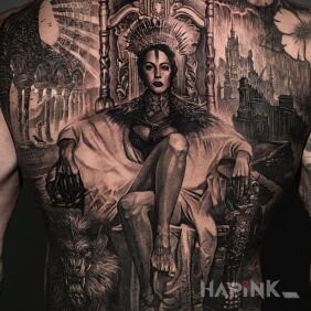 Tattoo Woman on the throne on the shoulder blades motif: animals style: realistic