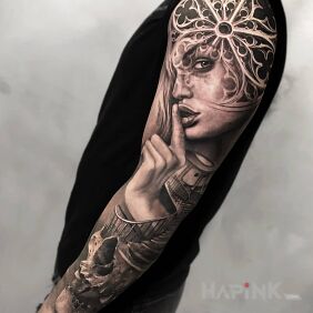 Tattoo Finger on the lips on the upper arm motif: faces style: realistic
