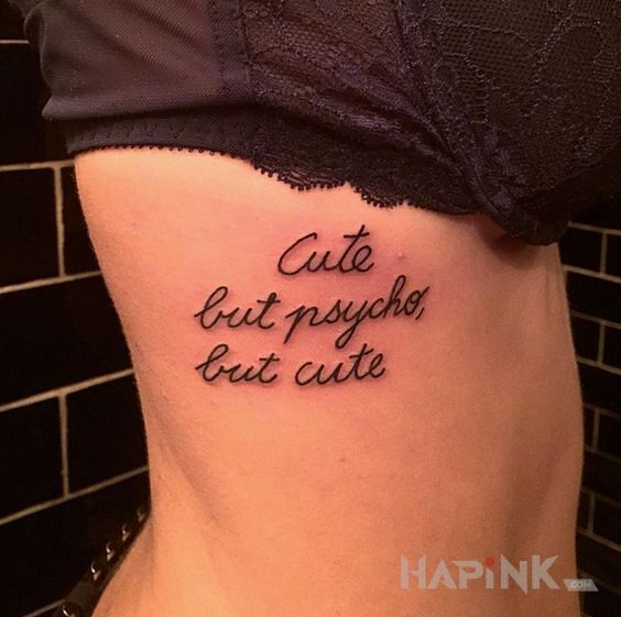 Tattoo Milutka ale psychiczna :) in lettering motif and calligraphy style on the ribs