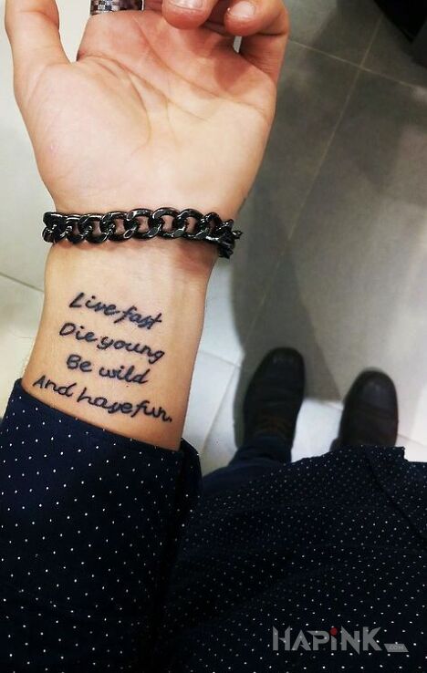Tattoo Co robic w zyciu in lettering motif and calligraphy style on the wrist