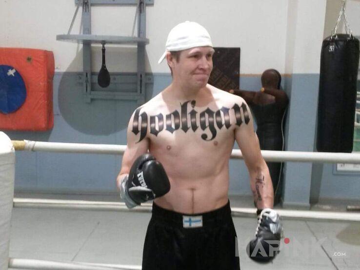 Tattoo Hooligans! in lettering motif on the chest