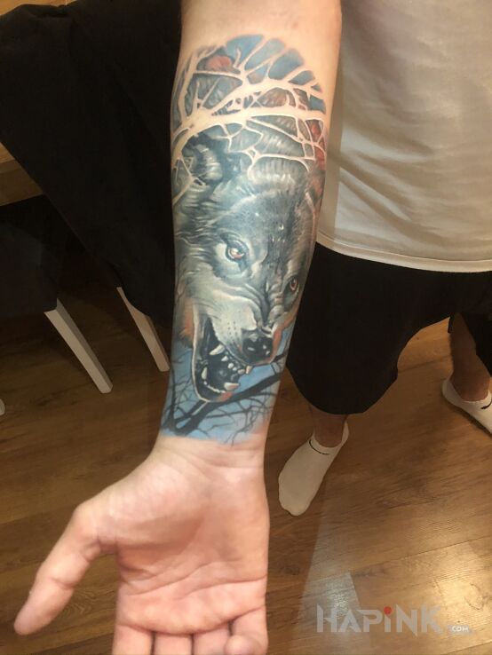 Tattoo Wilk in animals motif and realistic style on the forearm