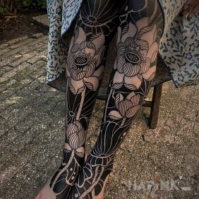Tattoo Legs in flowers on the tibia motif: black and gray style: blackwork / blackout