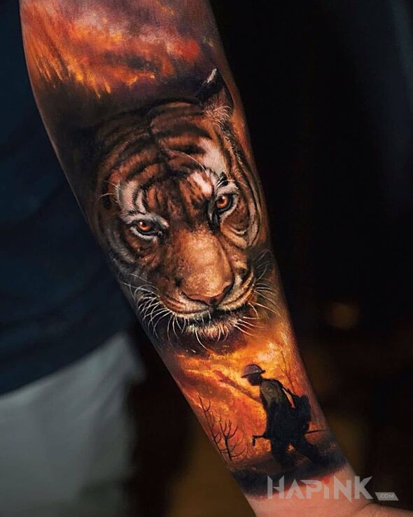 Tattoo Tygrys tiger in animals motif and realistic style on the forearm