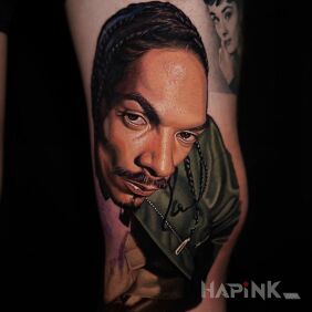 Tattoo Snoop Dogg on the leg motif: faces style: realistic