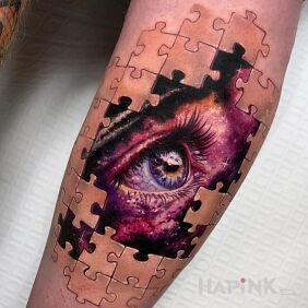 Tattoo Eye among the puzzle on the calf motif: colorful style: realistic