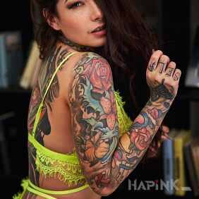 Tattoo Colored sleeve at super staff on the upper arm motif: sleeves style: graphic / illustrative