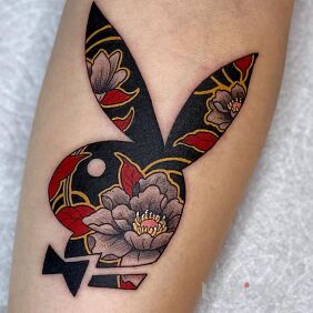 Tattoo Playboy bunny on the forearm motif: colorful style: japanese / irezumi