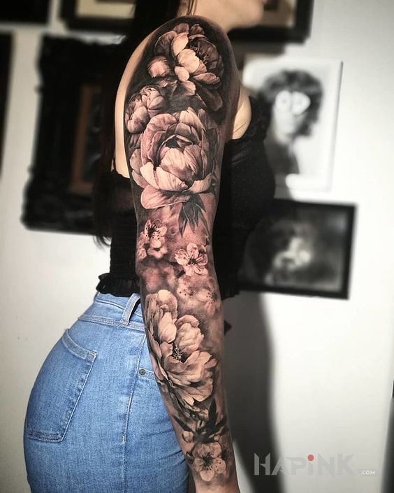 Tattoo Chryzantemy in sleeves motif and realistic style on the forearm