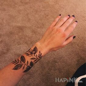 Tattoo Flower headband on the forearm motif: flowers style: graphic / illustrative