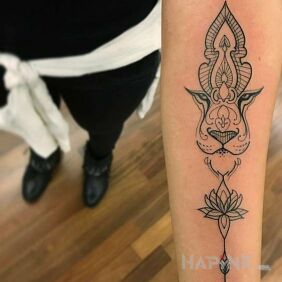 Tattoo Lion's mouth on the forearm motif: ornaments style: contour / linework