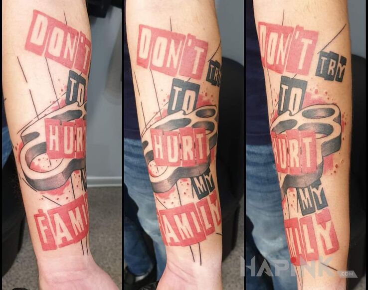 Tattoo Don't try to hurt my family. in lettering motif and trash polka style on the forearm