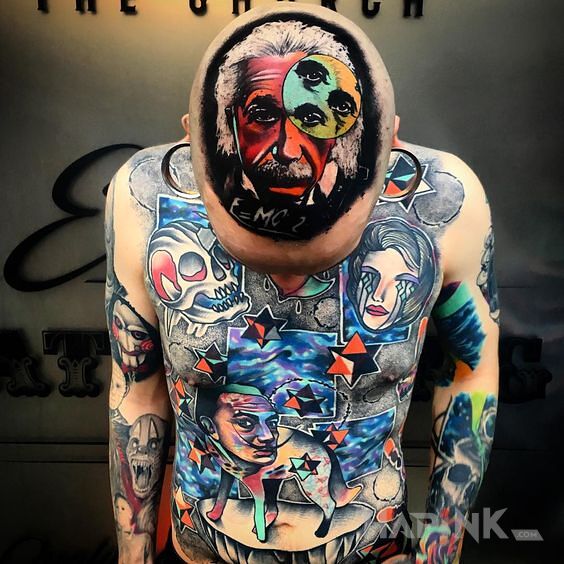 Tattoo Zwariowane tatuaże in faces motif and surrealistic style on the upper arm