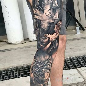 Tattoo Divinely tattooed leg on the calf motif: faces style: realistic