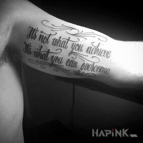 Tattoo Above its achievements on the upper arm motif: lettering style: calligraphy