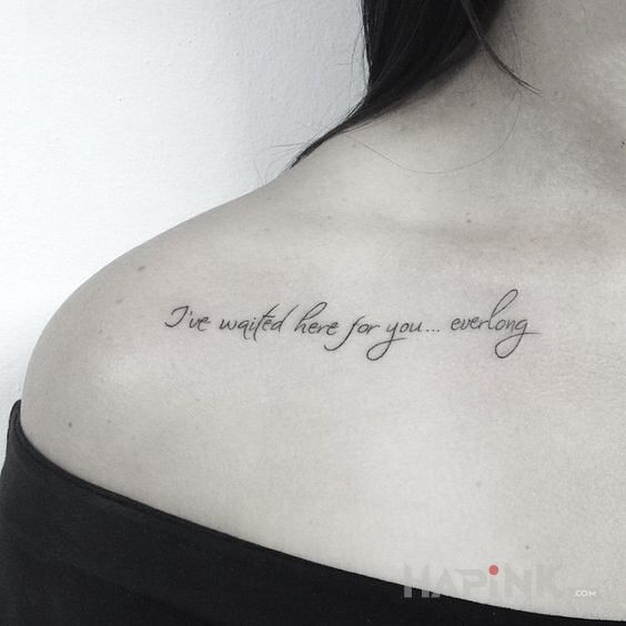 Tattoo I've waited here for you... ever long in lettering motif and calligraphy style on the collarbone