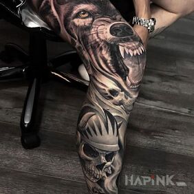 Tattoo Huge wolf on the calf motif: flowers style: realistic
