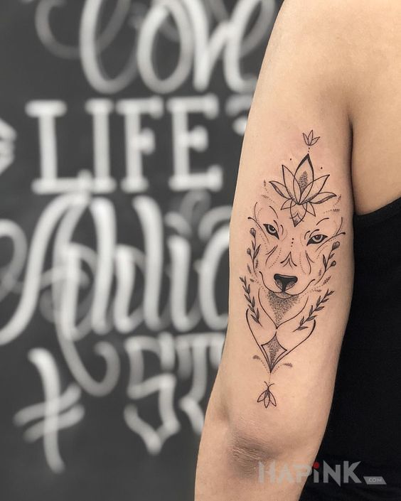 Tattoo Pyszczek wilka in black and gray motif and graphic / illustrative style on the upper arm