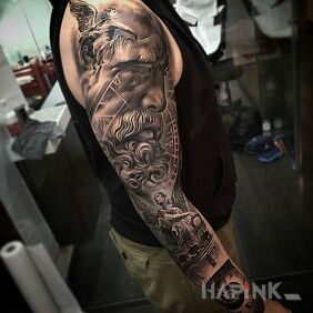 Tattoo Great bearded face on the forearm motif: faces style: realistic
