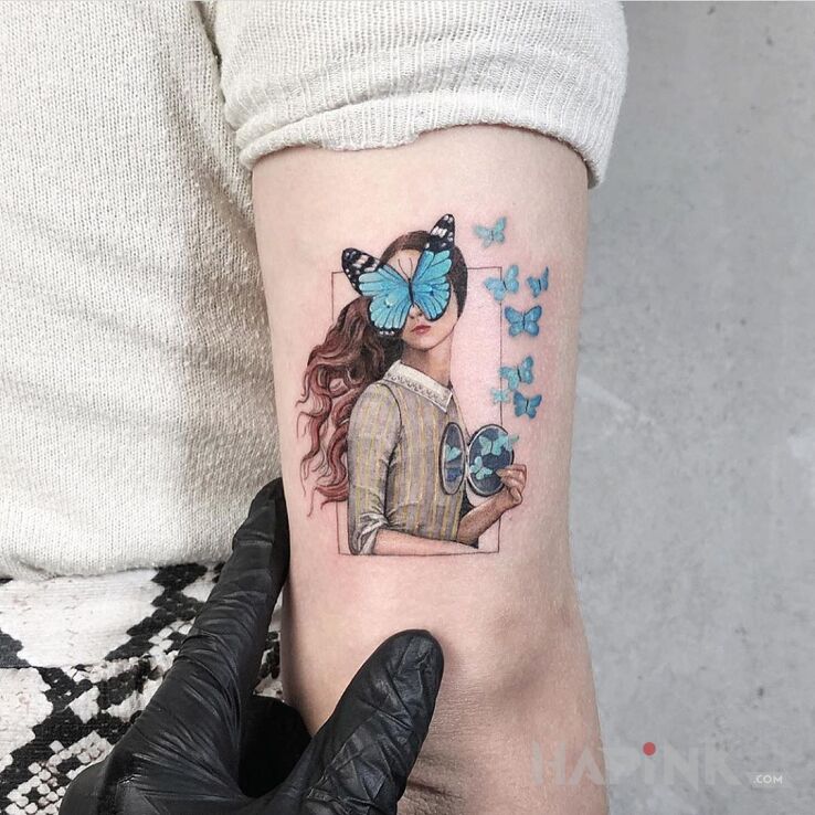 Tattoo Motylki in characters motif and abstract style on the upper arm