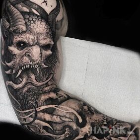Tattoo Devil on hand on the forearm motif: black and gray style: graphic / illustrative
