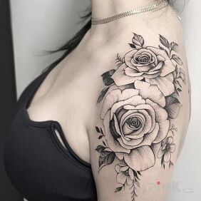 Tattoo Two roses on the shoulder on the upper arm motif: flowers style: realistic