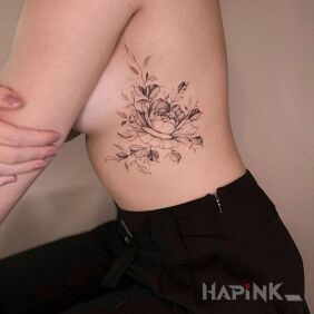 Tattoo Flower on a rib on the ribs motif: black and gray style: graphic / illustrative