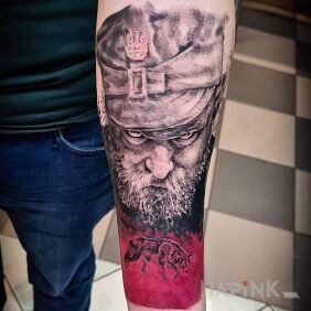 Tattoo Hubal on the forearm motif: patriotic style: realistic