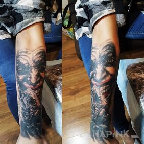 Tattoo Joker on the forearm motif: black and gray style: realistic