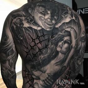 Tattoo Naked girl under the influence of a clown :) on the back motif: dark style: realistic