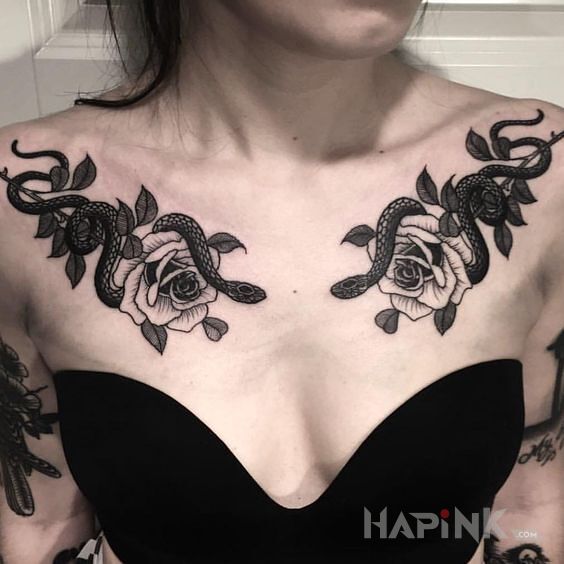 Tattoo Węże oplecione dookoła róż in flowers motif and graphic / illustrative style on the chest