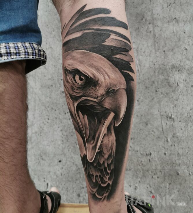 Tattoo Orzeł in black and gray motif and realistic style on the calf