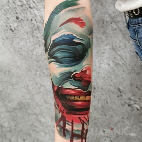 Tattoo Joker on the forearm motif: colorful style: graphic / illustrative