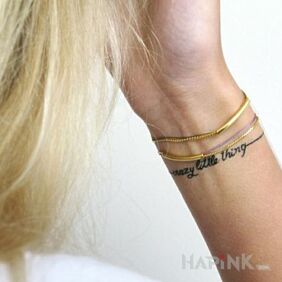 Tattoo Knit bracelet style on the wrist motif: lettering style: calligraphy