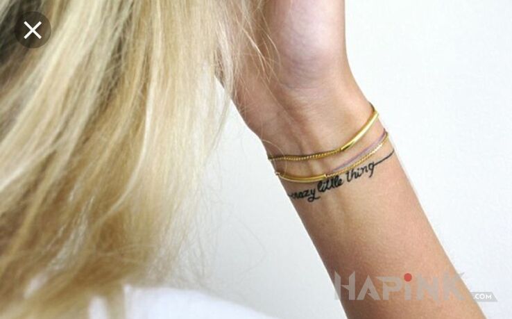 Tattoo Dziarka w stylu bransoletki in lettering motif and calligraphy style on the wrist