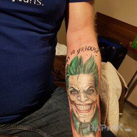 Tattoo Joker on the forearm motif: characters style: graphic / illustrative