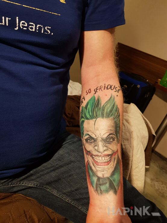 Tattoo Joker in faces motif and graphic / illustrative style on the forearm