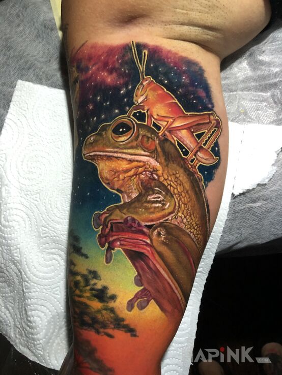 Tattoo Przyjaciele in cosmos motif and abstract style on the upper arm