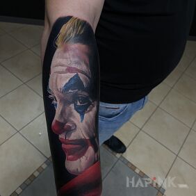 Tattoo Joker on the forearm motif: faces style: realistic