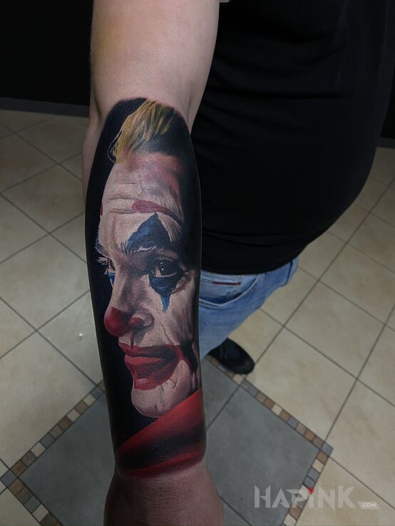 Tattoo Joker in 3D motif and realistic style on the forearm