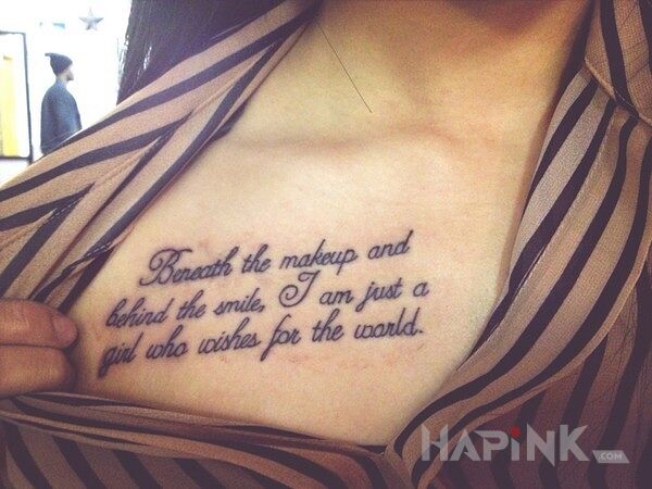 Tattoo Napis na klatce piersiowej in lettering motif on the chest