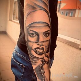 Tattoo Nun on the forearm motif: objects style: realistic