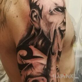 Tattoo Mixed CD 2 on the upper arm motif: black and gray style: realistic