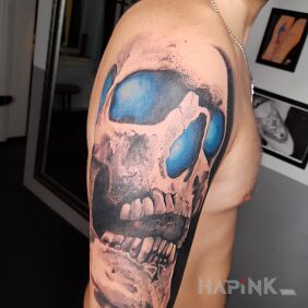 Tattoo Skull on the upper arm motif: black and gray style: realistic
