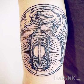 Tattoo Lamp on the upper arm motif: objects style: engravings / gravure