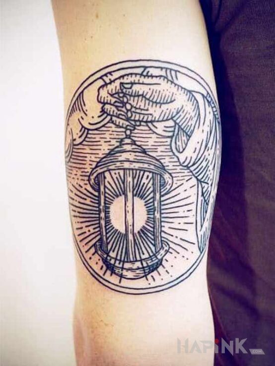 Tattoo Lampa in objects motif and engravings / gravure style on the upper arm