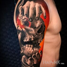 Tattoo Skull in hands on the upper arm motif: colorful style: realistic