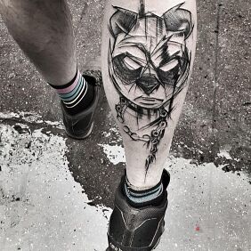 Tattoo The menacing panda on the calf motif: black and gray style: sketch
